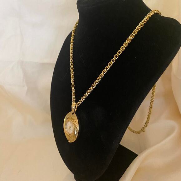 Vintage Caravelle Pendant Watch: Brocaded Gold Tone Oval 7 Jewel Mechanical main image 2
